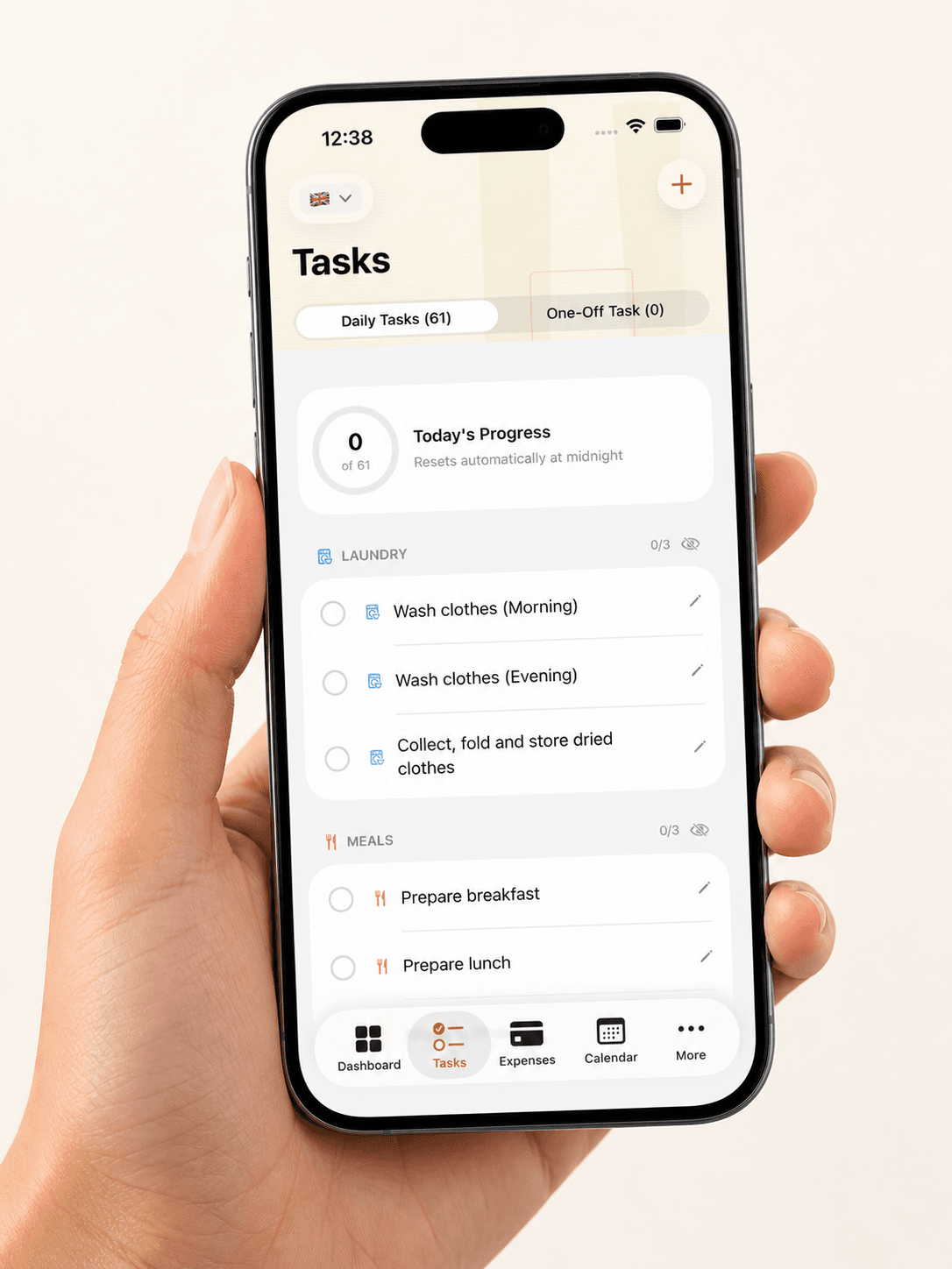 A person holding a smartphone with a daily task management app, including tasks like laundry and dinner